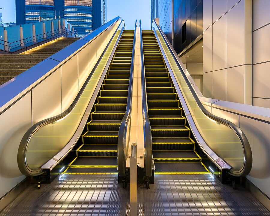 Illuminated outdoor escalator at Shinjuku Station