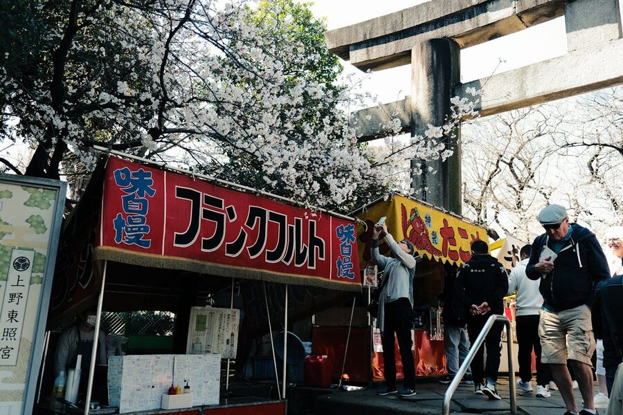 Food stalls near Ueno Toshogu shrine during hanami cherry blossom season