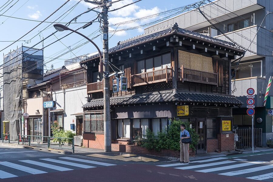 Quiet residential street in Yanaka Tokyo with wooden houses